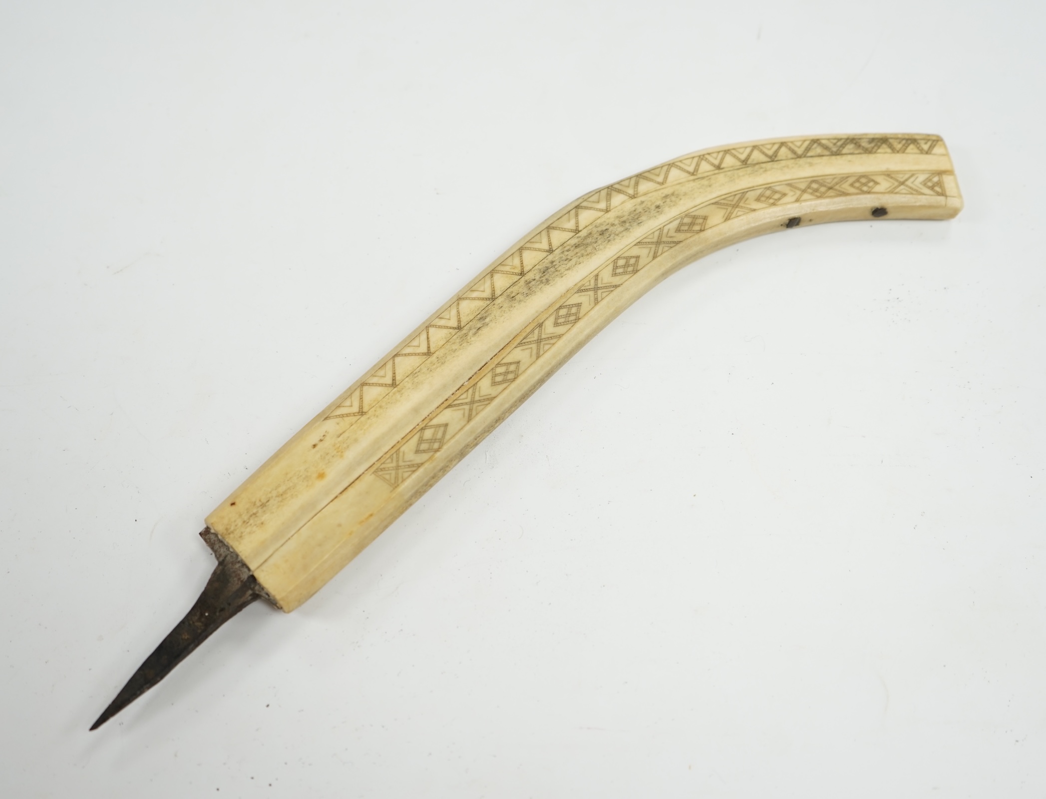 An Inuit? decorated bone blade sheath, 26cm in length. Condition - poor to fair